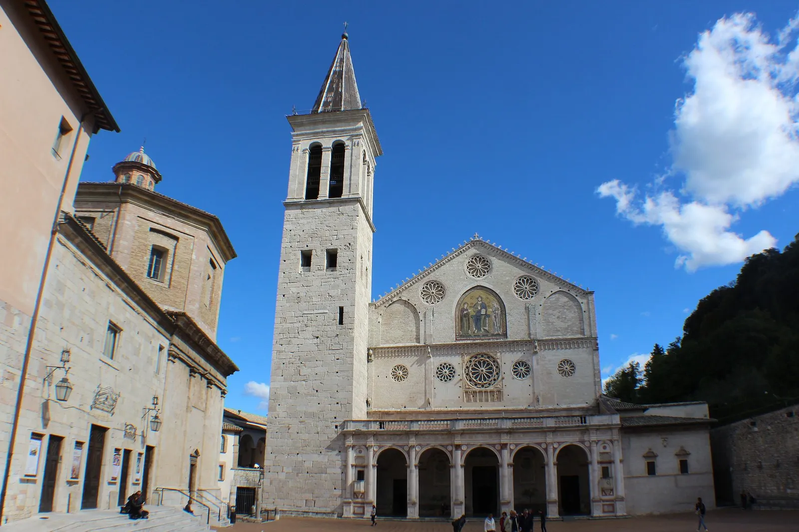 Spoleto cathedral with its mosaic façade, rose windows and stone bell tower